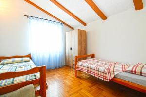 Postel nebo postele na pokoji v ubytování Apartments Otmar 1224
