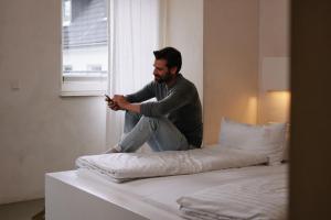 Ein Bett oder Betten in einem Zimmer der Unterkunft 18Arts Hotel - Living in a Gallery!