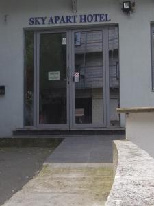 an entrance to a ski apartment hotel with glass doors at SKY APART HOTEL - Hotel EUROCAP in Brussels