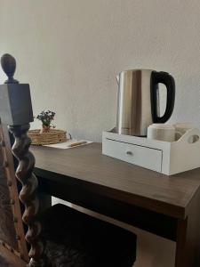a table with a coffee pot on top of it at Torre Galli-Dimora di Campagna in Gasponi +100 photos