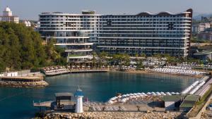 a resort with a pool of water and a large building at Mylome Luxury Hotel & Resort - Ultra All Inclusive in Okurcalar