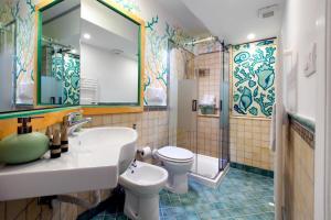 a bathroom with a sink and a toilet at Estate4home - Casa Nonna Mary in Positano +57 photos