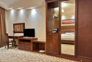 TV a/nebo společenská místnost v ubytování Hotel Sultan