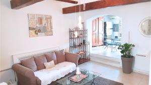 Posedenie v ubytovaní Maison avec Jacuzzi et terrasse sur les toits