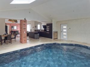 a large swimming pool in the middle of a living room at Maison avec piscine en centre ville in Vendôme