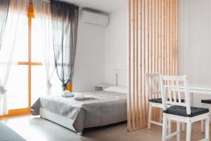 Ένα ή περισσότερα κρεβάτια σε δωμάτιο στο Apartamentos Wayteko Calpe +44 φωτογραφίες