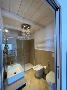 a bathroom with a sink and a toilet and a shower at Sea view Camogli Portofino in Camogli
