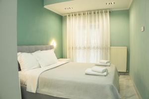 Postel nebo postele na pokoji v ubytování Mourati House