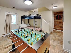 a room with a table with a soccer game on it at Bear Feet in Oakland