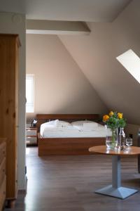 A bed or beds in a room at Penzion a restaurace Bílý Mlýn
