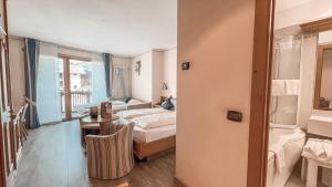 Posteľ alebo postele v izbe v ubytovaní Hotel Flora