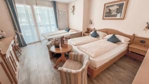 Posteľ alebo postele v izbe v ubytovaní Hotel Flora