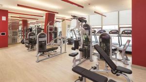 a gym with several treadmills and cardio machines at Apt with Gym and Pool in Stamford