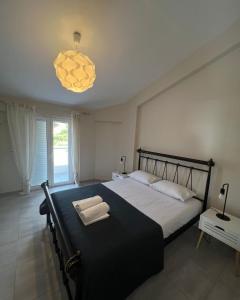Postel nebo postele na pokoji v ubytování Filikouri Rooms