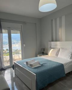 Postel nebo postele na pokoji v ubytování Filikouri Rooms