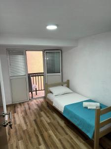 Postel nebo postele na pokoji v ubytování RiO Apartmani