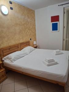 Postel nebo postele na pokoji v ubytování Albergo quatro pini