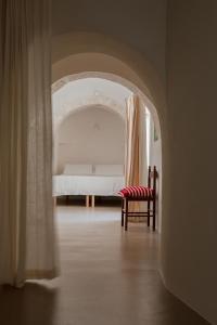 Ένα ή περισσότερα κρεβάτια σε δωμάτιο στο Trullo fiorone with private pool