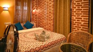 Letto o letti in una camera di Hong Si Hotel- A Home Away from Home