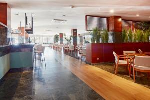 Reštaurácia alebo iné gastronomické zariadenie v ubytovaní Prestige Victoria