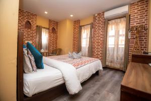 Letto o letti in una camera di Hong Si Hotel- A Home Away from Home