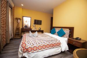 Letto o letti in una camera di Hong Si Hotel- A Home Away from Home