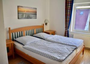Ein Bett oder Betten in einem Zimmer der Unterkunft Ferienhaus Fiete 2