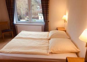 Ein Bett oder Betten in einem Zimmer der Unterkunft Ferienhaus Fiete 2