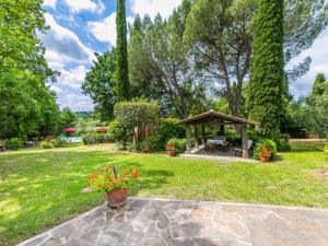 a garden with a gazebo and flowers at Holiday Home Tenuta La Colonna by Interhome in Ponte di Masino
