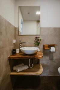 a bathroom with a white sink and a mirror at Motel Sleep Inn in Töging am Inn