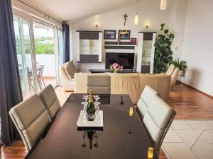 a living room with a table and chairs at Apartment Mirjana by Interhome in Maslenica