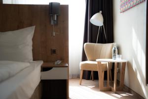 A bed or beds in a room at Hotel Liberec