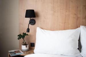 A bed or beds in a room at Hotel Liberec