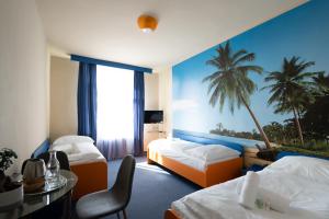 Posteľ alebo postele v izbe v ubytovaní Hotel Liberec + 34 fotografií