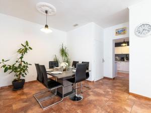 a dining room with a table and chairs at Holiday Home Jasmine by Interhome in Vendres +16 photos