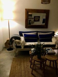 a living room with a couch and a table at Comporta Cottage in Montevil
