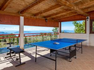 a ping pong table on a balcony with a view at Holiday Home Marita by Interhome in Sveti Juraj