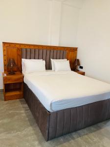 Postel nebo postele na pokoji v ubytování Cozy Homestay