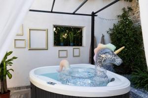 a bath tub with a rubber duck in it at Moulin du désir in Montauroux