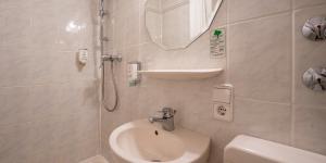 Ванна кімната в PLAZA INN Rieker Stuttgart Hauptbahnhof