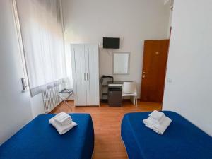 Łóżko lub łóżka w pokoju w obiekcie Oasi San Francesco
