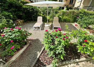 Um jardim no exterior de Residence Mutschellen