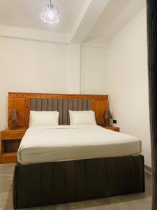Postel nebo postele na pokoji v ubytování Cozy Homestay