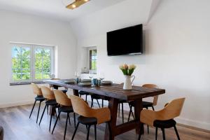 TV a/nebo společenská místnost v ubytování Ferienwohnung Ostwind