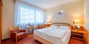 Ліжко або ліжка в номері PLAZA INN Rieker Stuttgart Hauptbahnhof