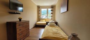 Posteľ alebo postele v izbe v ubytovaní APARTAMENT RELAX