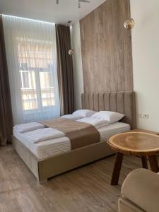 Posteľ alebo postele v izbe v ubytovaní Тиктора, 3 ЦЕНТР