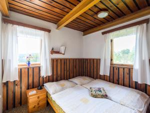 Ένα ή περισσότερα κρεβάτια σε δωμάτιο στο Holiday Home Hoja by Interhome