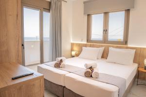 Ένα ή περισσότερα κρεβάτια σε δωμάτιο στο Villa Leandros Premium Suites