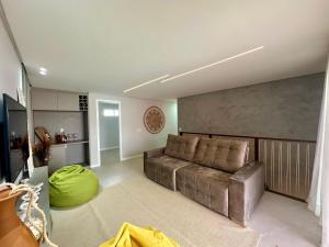 Χώρος καθιστικού στο Cobertura exclusiva duplex com vista incrível da praia de Porto das Dunas